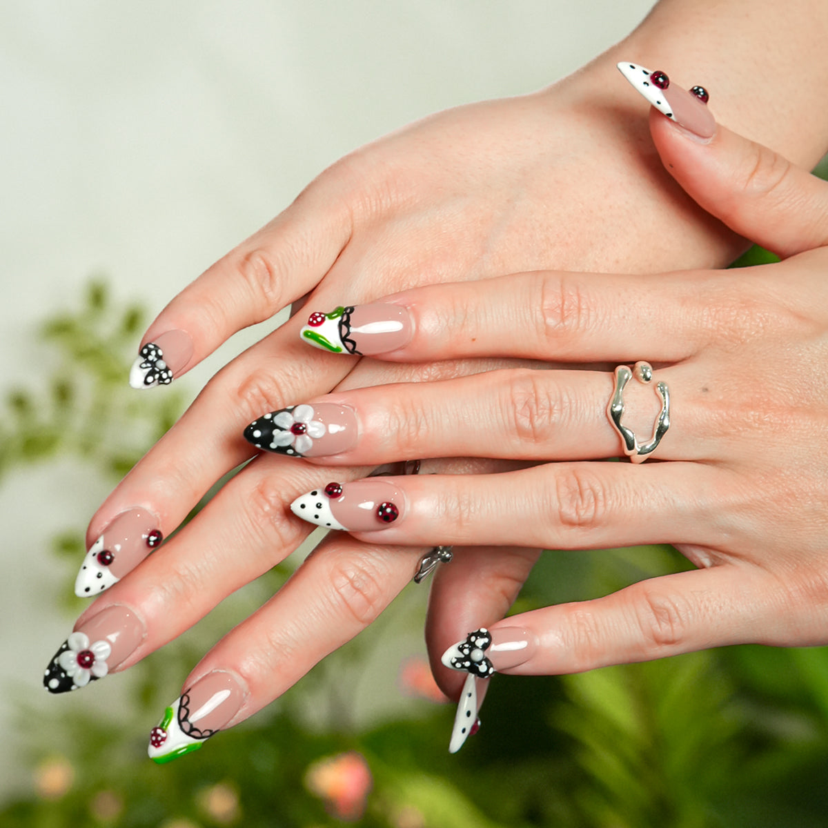 Woman wearing Ladybug Party red cute press on nails