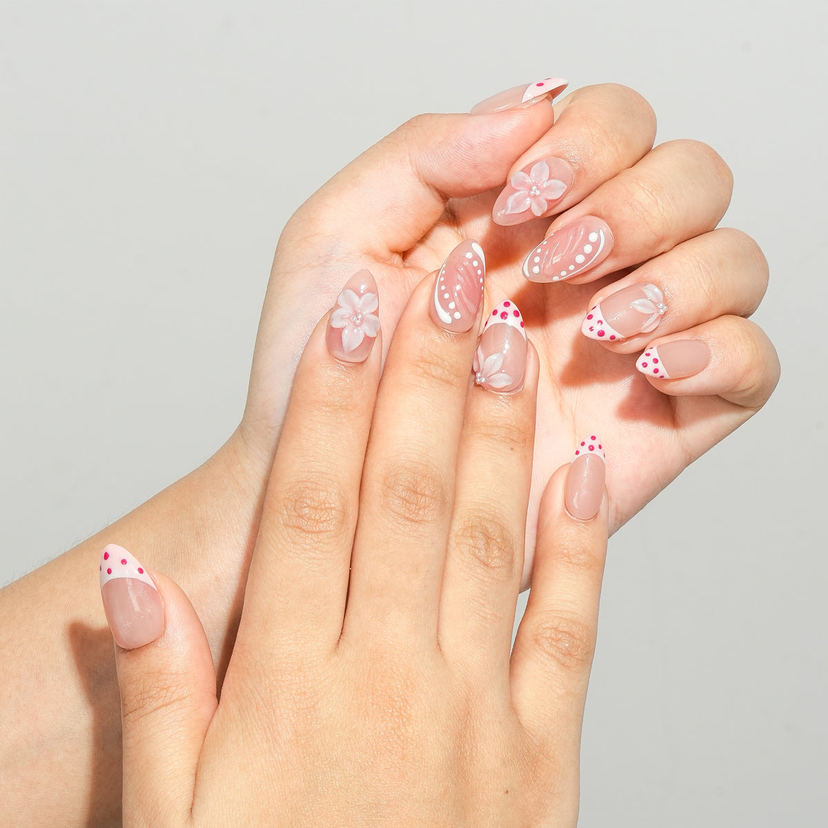 Close up of Berry French pink gel press on nails with elegant French tips